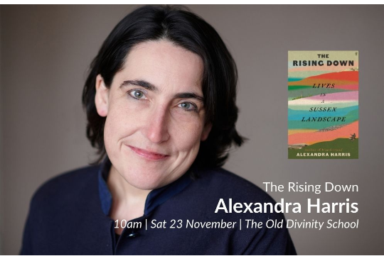 A photograph of Alexandra Harris looking at camera